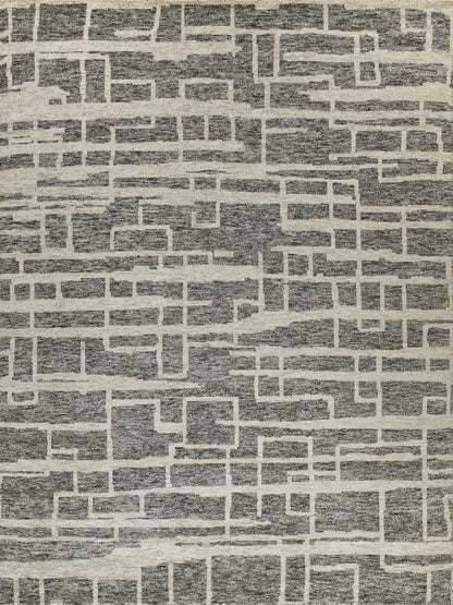 Rectangular area rug in gray and beige with a brick-like geometric pattern; modern, textured look; 6' x 9