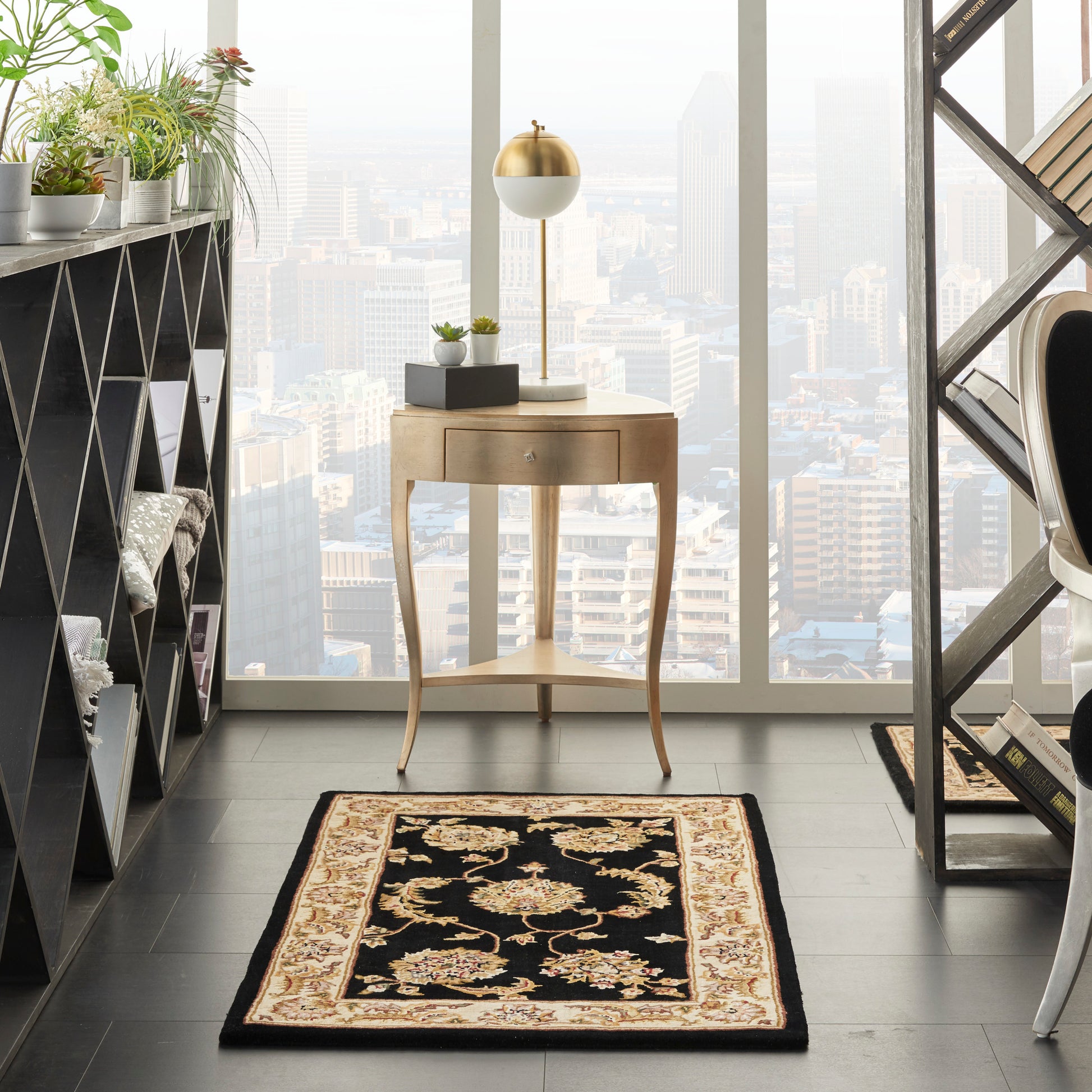 Traditional 3' x 4' ornate black-and-tan rug in a modern home office corner.
