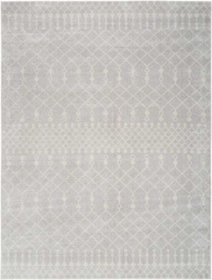 Soft gray area rug with a subtle white geometric lattice and diamond pattern; cozy woven texture.