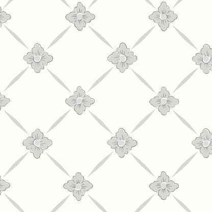 Grey floral lattice pattern with small four-petaled blossoms at diamond intersections on pale ivory background