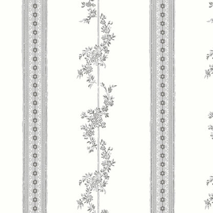 Grey wallpaper with vertical floral vines and lace-edged stripes.