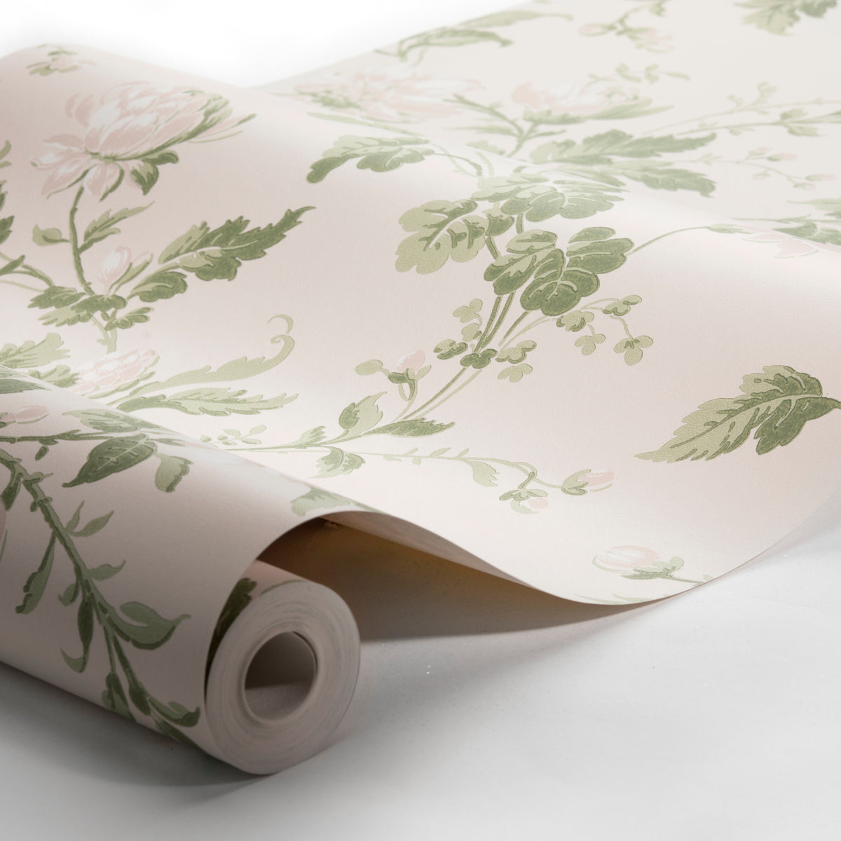 Cream wallpaper with green leafy botanical pattern, rolled on a cardboard tube.