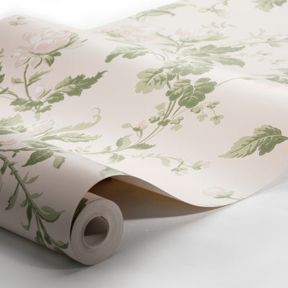Cream wallpaper with green leafy botanical pattern, rolled on a cardboard tube.