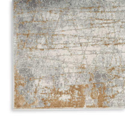 Rectangular area rug with abstract, distressed grey, ivory and tan pattern; soft plush pile.