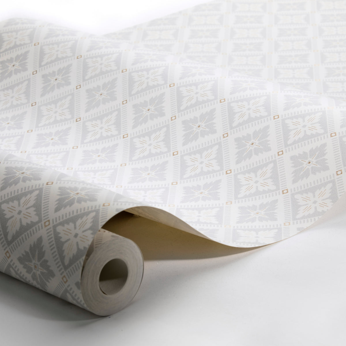 White wallpaper roll with pale gray floral geometric squares and tiny gold accents; decorative wallcovering.