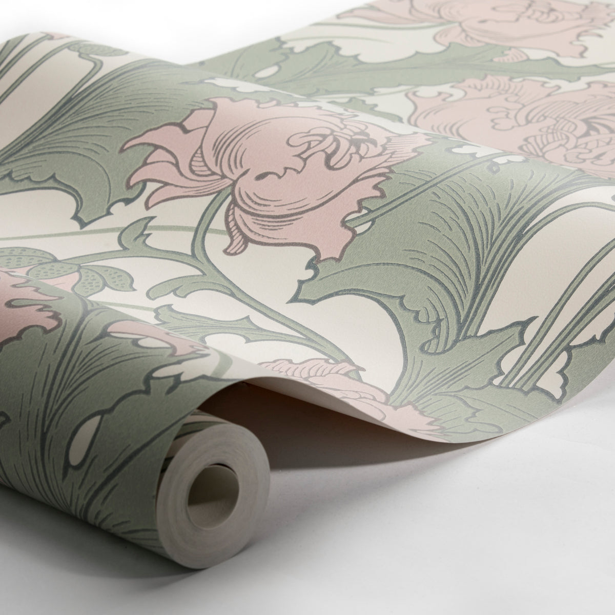 Rolled wallpaper with a green leaf pattern on a light neutral backdrop; inner cardboard core visible.