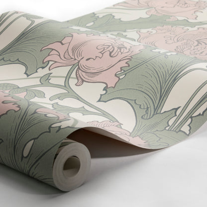 Rolled wallpaper with a green leaf pattern on a light neutral backdrop; inner cardboard core visible.