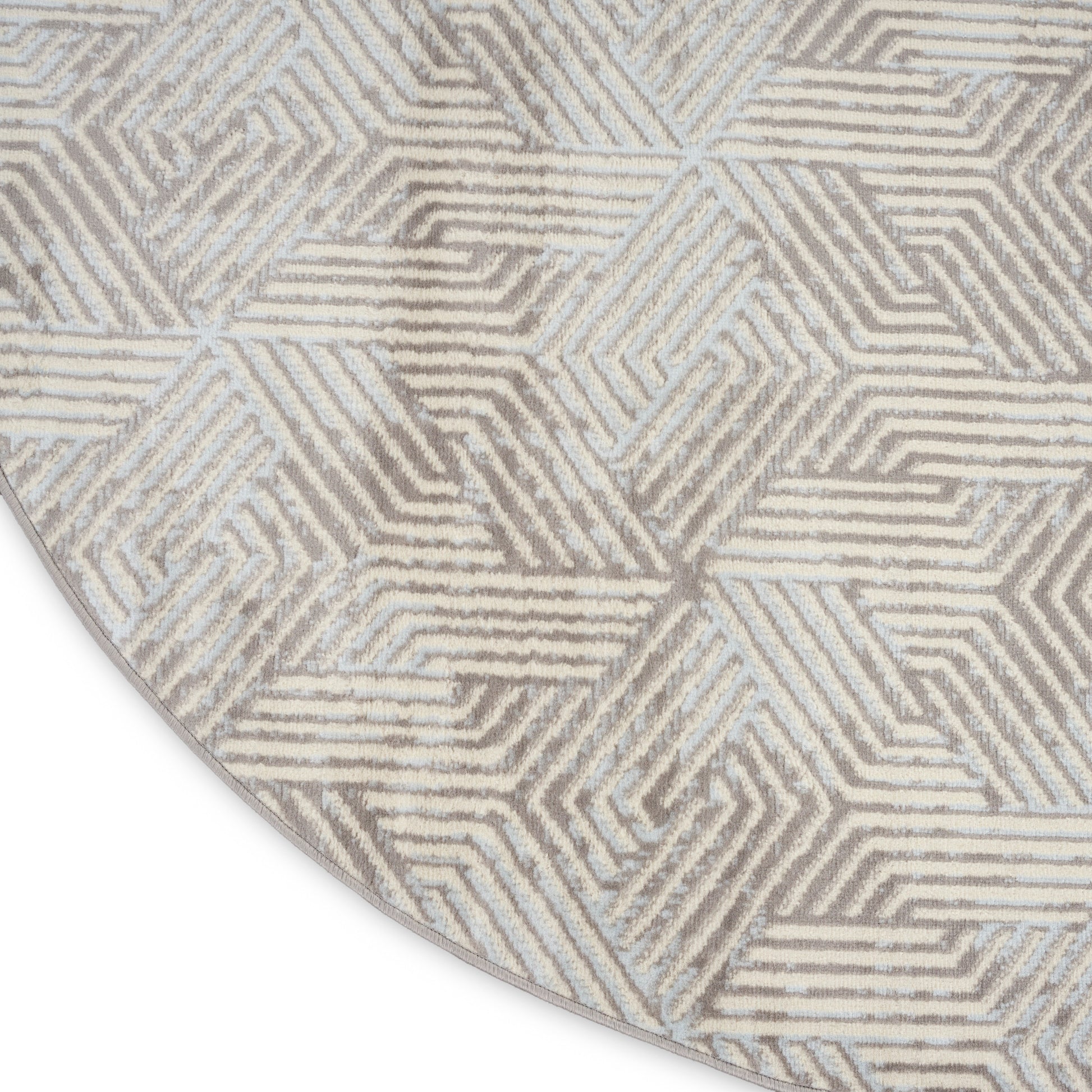 Round rug with a geometric maze pattern in taupe and ivory, woven texture for contemporary living spaces.