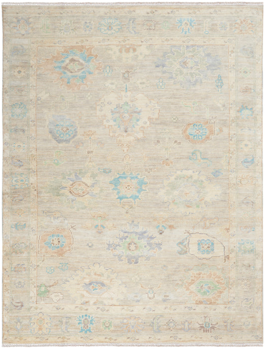Light beige oriental rug with faded pastel blue, peach and mint floral medallions and a decorative border.