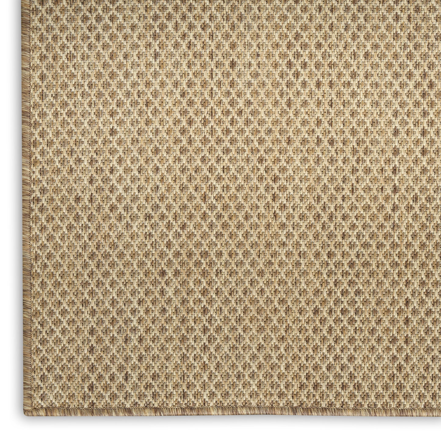 Beige woven jute rug close-up with diamond texture and stitched border.