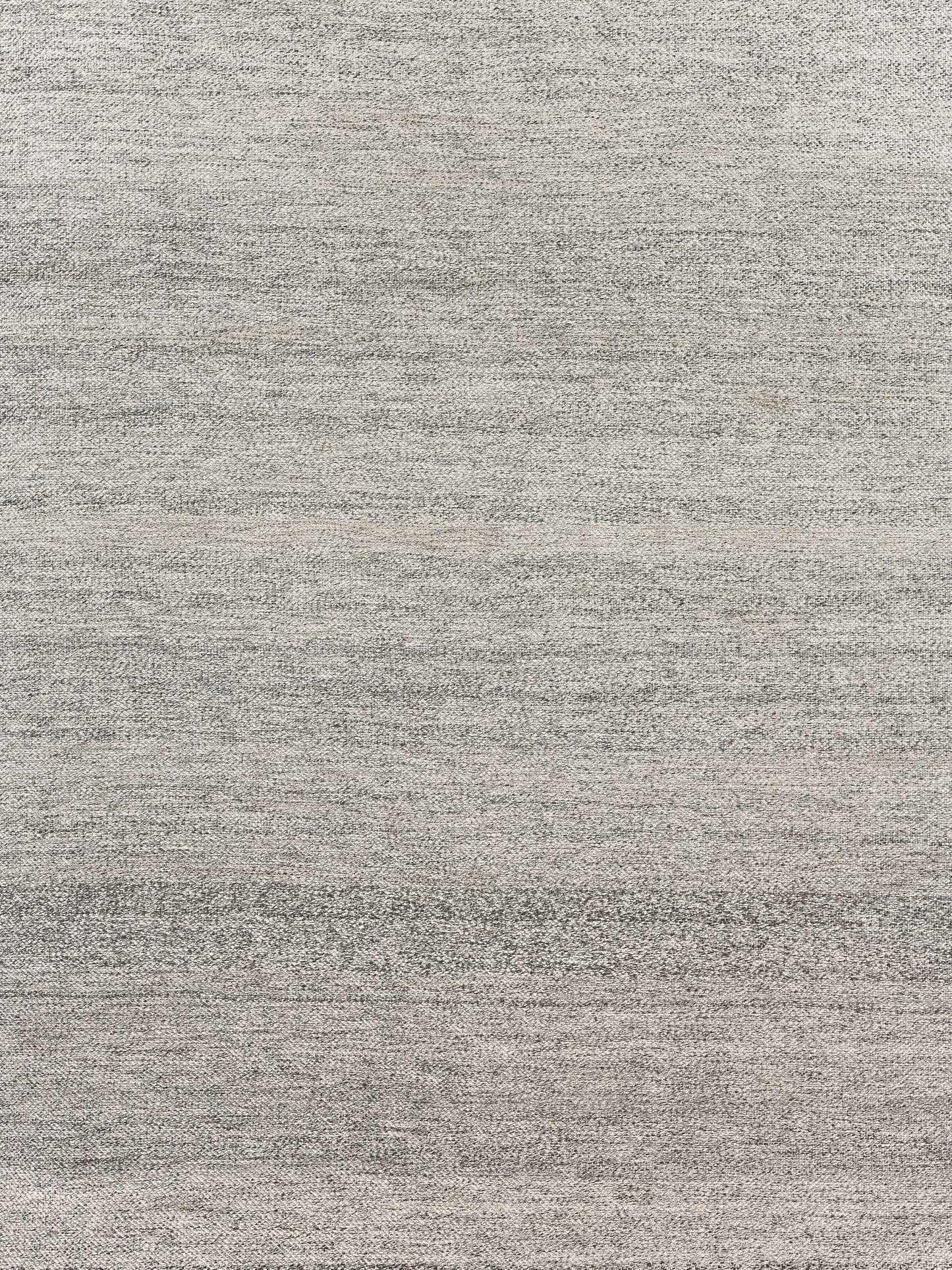 Light gray heathered woven rug texture with subtle tonal variation.
