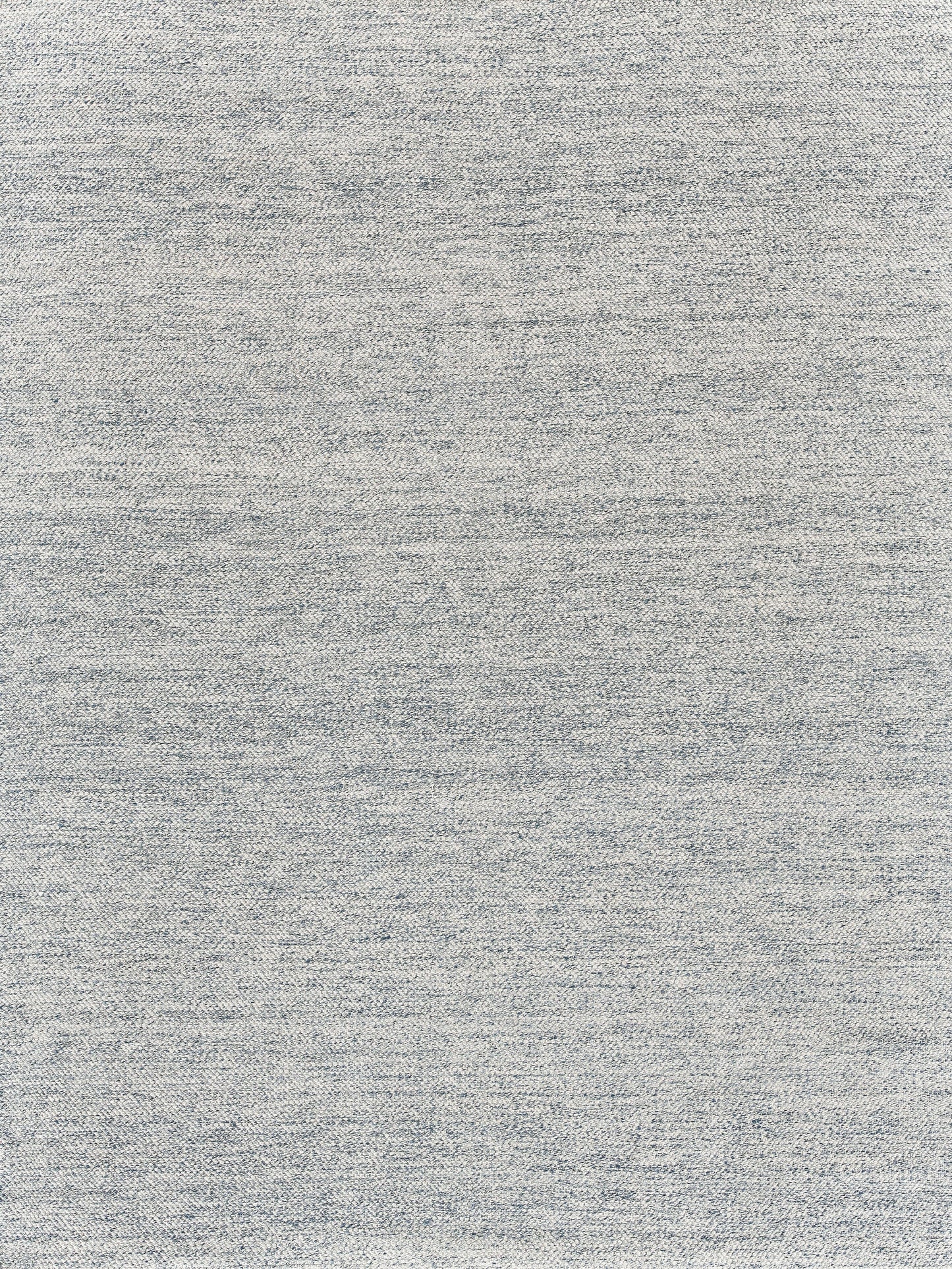 Light gray heather rug with a subtle speckled pattern.