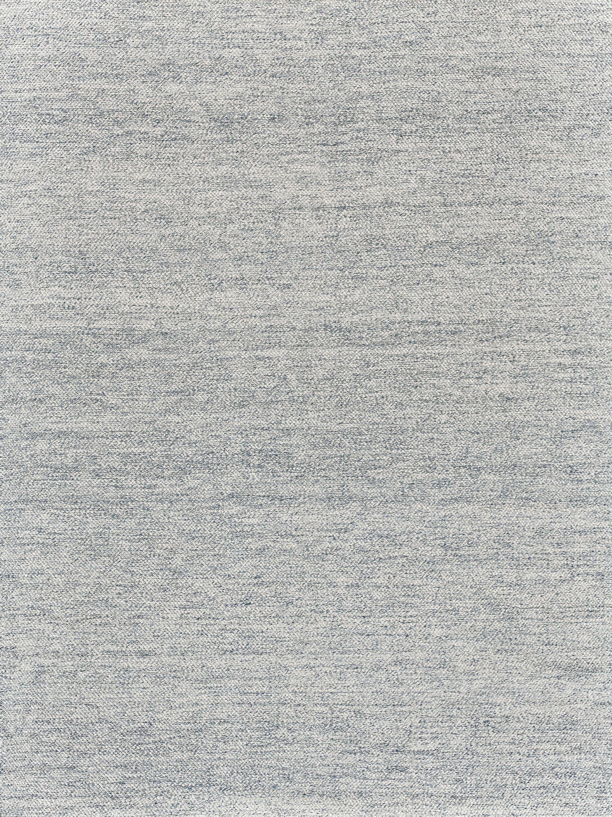 Light gray heather rug with a subtle speckled pattern.
