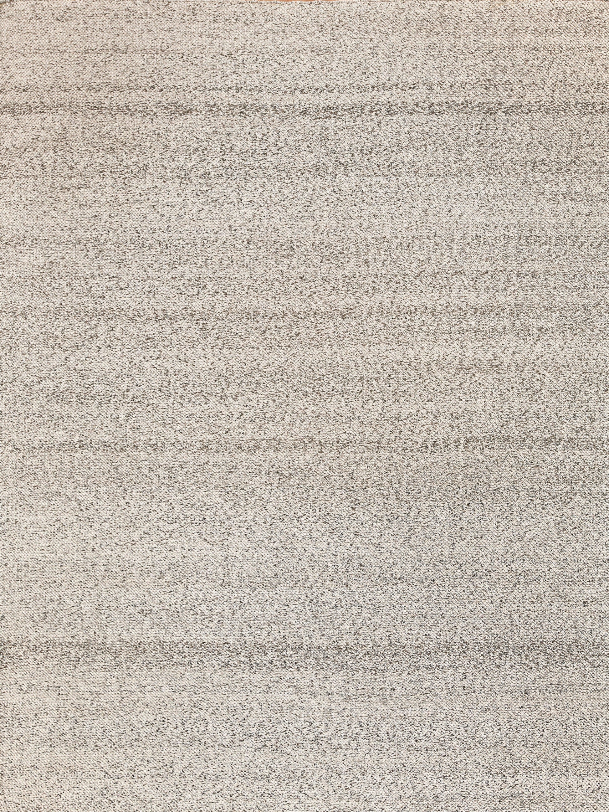 Beige textured rug with soft woven pile and subtle horizontal stripes for living room or bedroom.