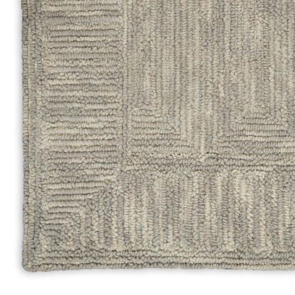 Beige-gray textured shag rug with geometric rectangular block pattern and plush, looped pile.