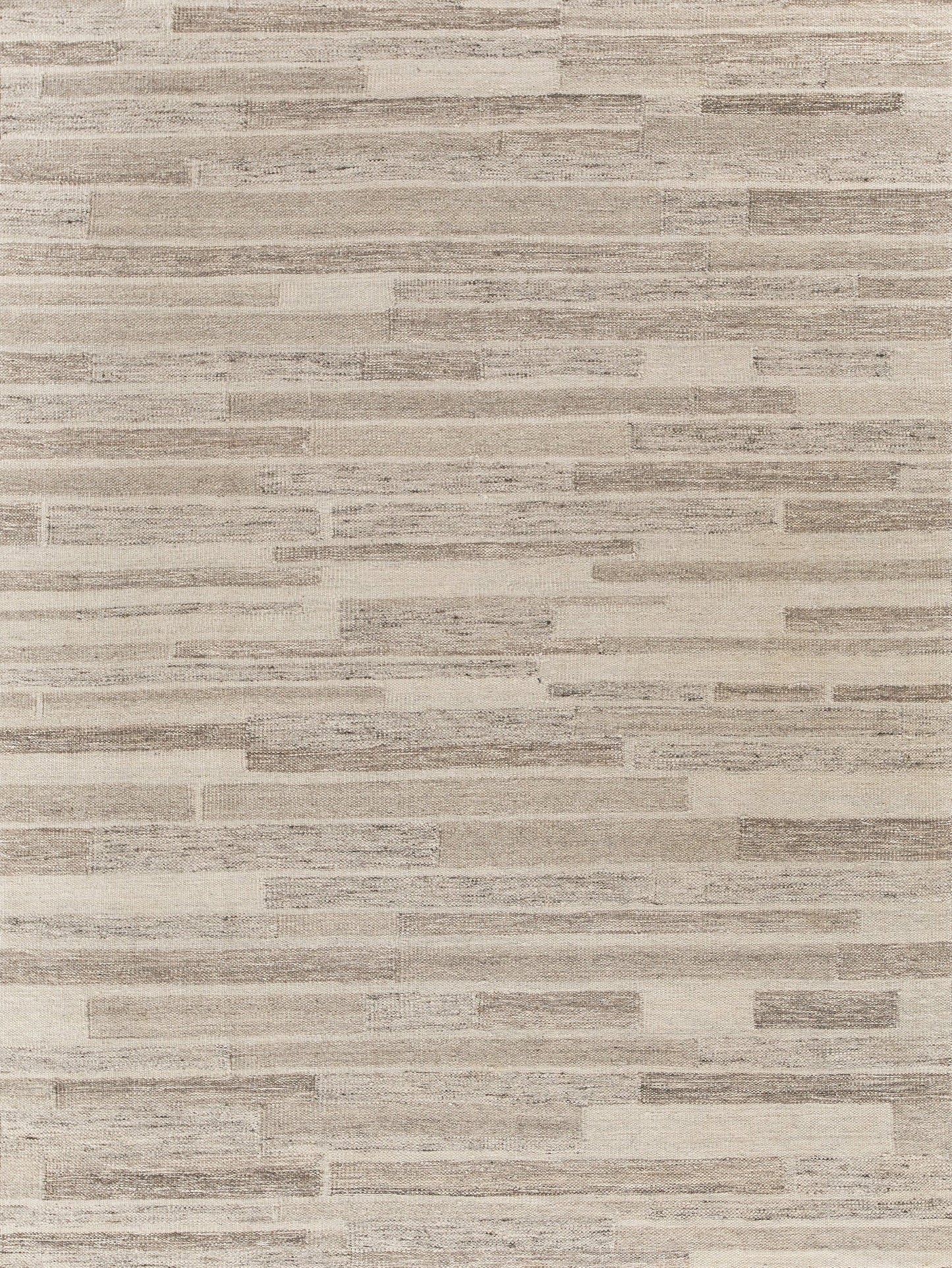 Beige taupe hand-loomed rug with a subtle linear weave; indoor Scandinavian-style rug.