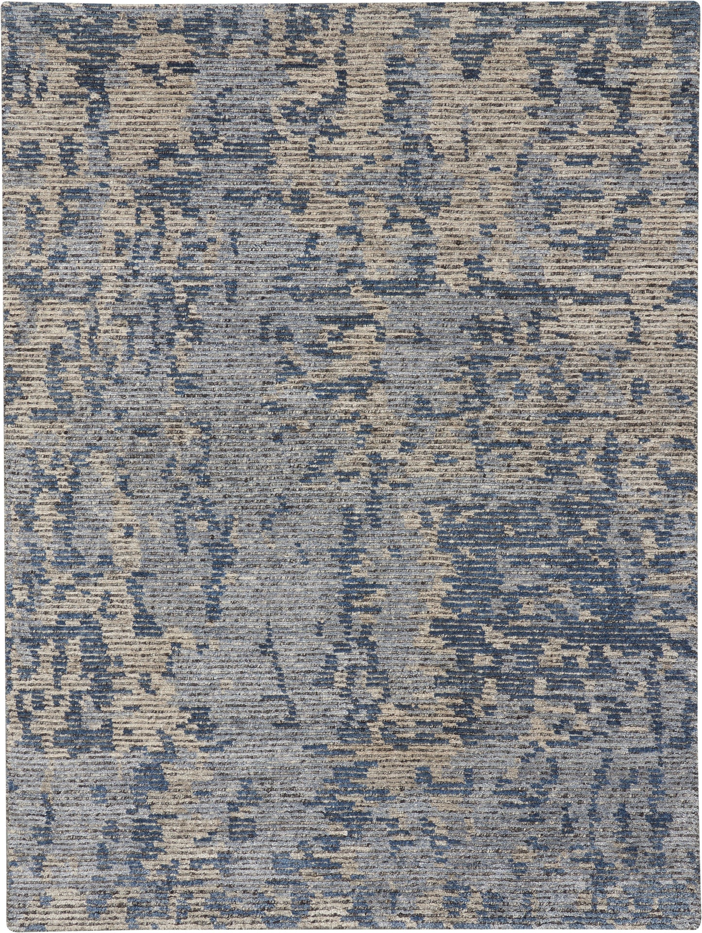 Rectangular blue-gray distressed woven rug with abstract pattern, modern contemporary style for living room or bedroom.