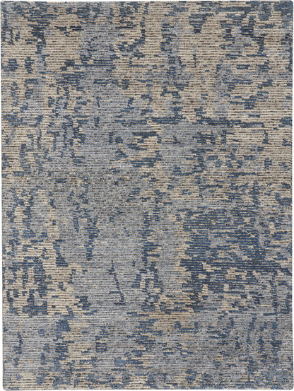 Rectangular blue-gray distressed woven rug with abstract pattern, modern contemporary style for living room or bedroom.