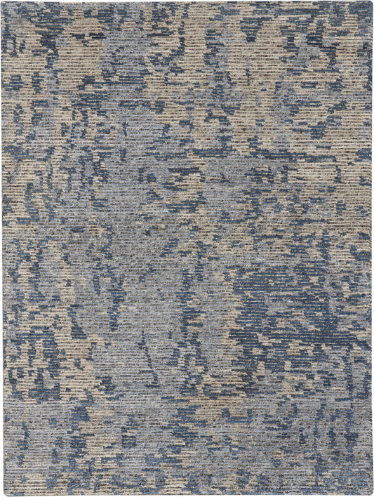 Rectangular blue-gray distressed woven rug with abstract pattern, modern contemporary style for living room or bedroom.