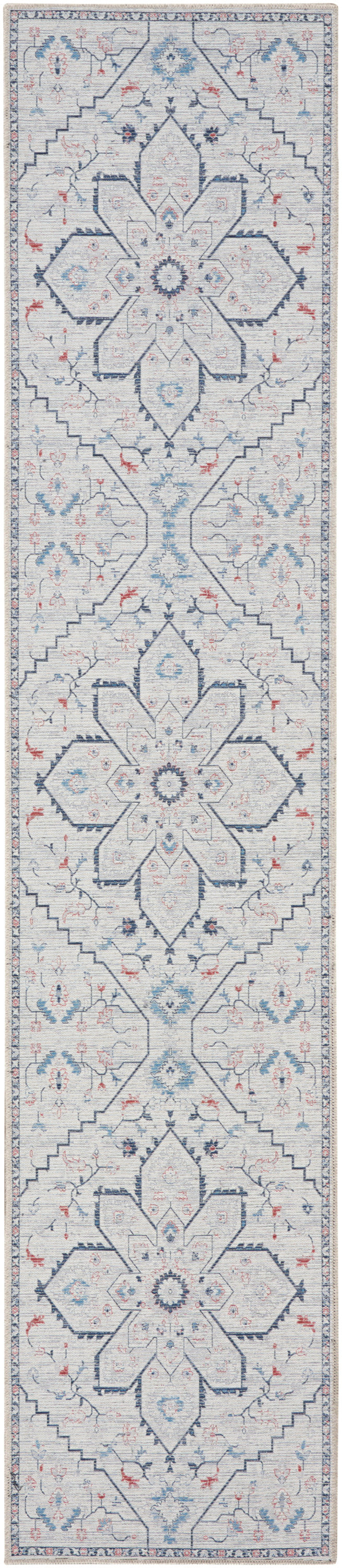 Farmhouse-style runner rug in ivory and light blue with navy geometric star medallions, pink accents, and a decorative border.