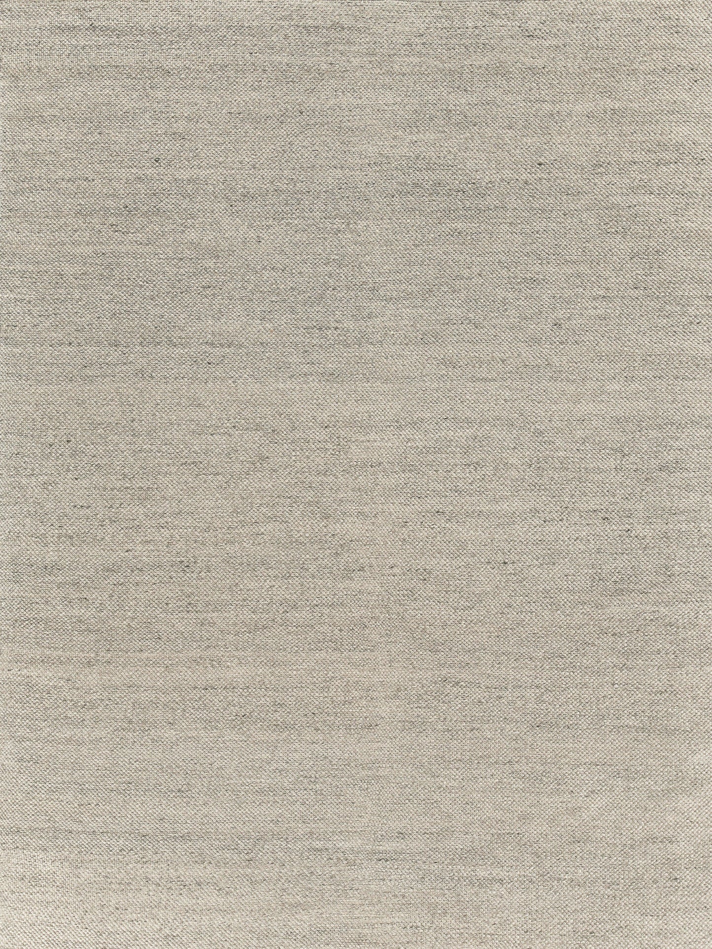 Beige hand-loomed rug with subtle slub texture; indoor use. 5'6" x 7'6
