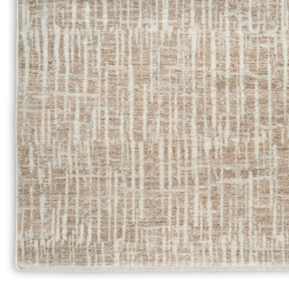 Beige abstract-pattern rug with cream vertical lines, soft textured pile and fringed edges.