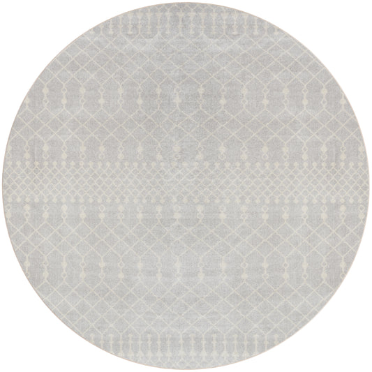 Round gray rug with a pale white geometric lattice motif and soft woven texture.