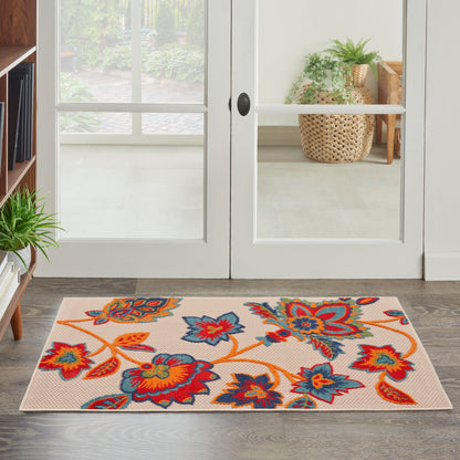 Rectangular beige contemporary rug with a bright multicolor floral motif in orange, red and blue on a light background, 3' x 4'.