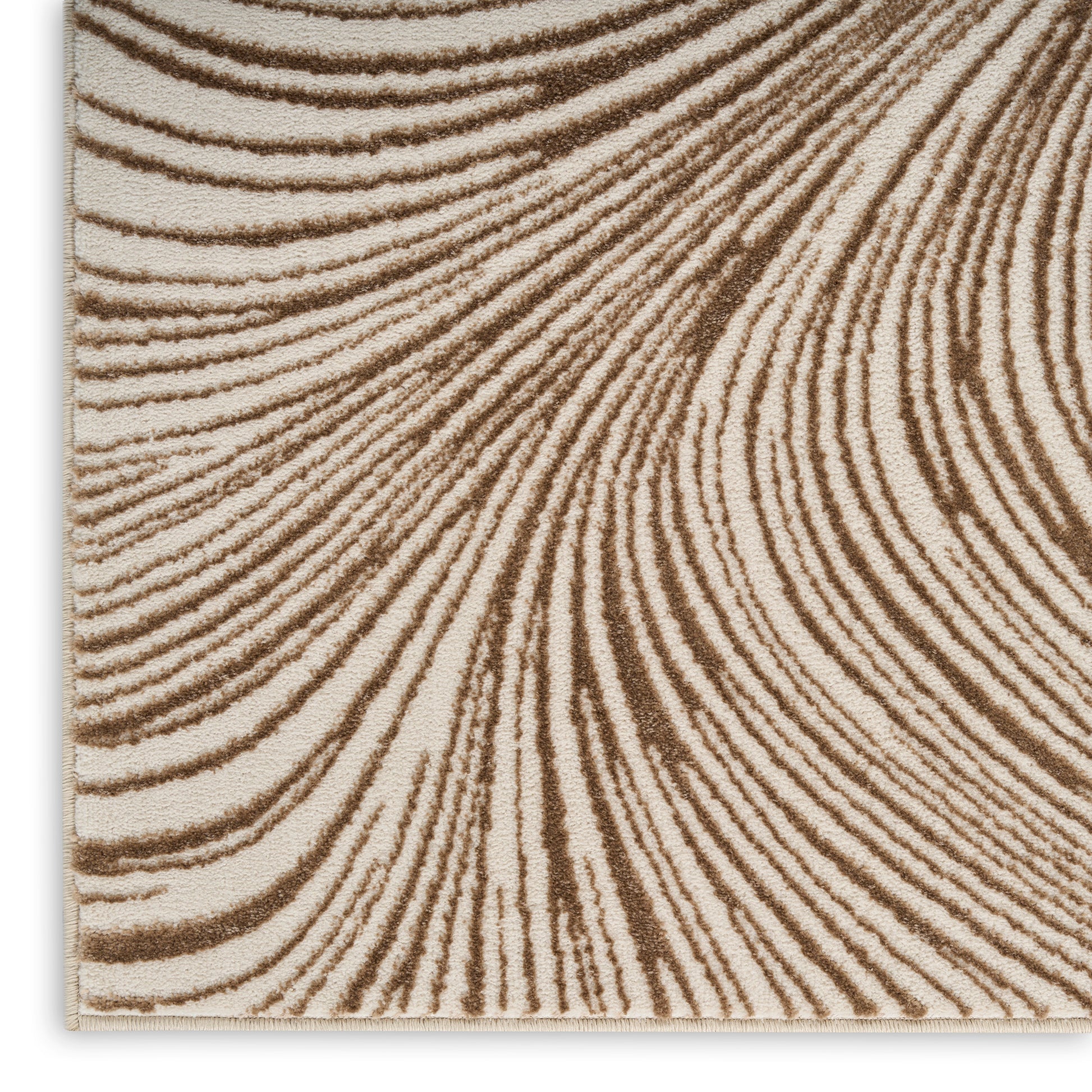 Beige rug with brown zebra-stripe pattern, soft woven texture, rectangular home decor piece.