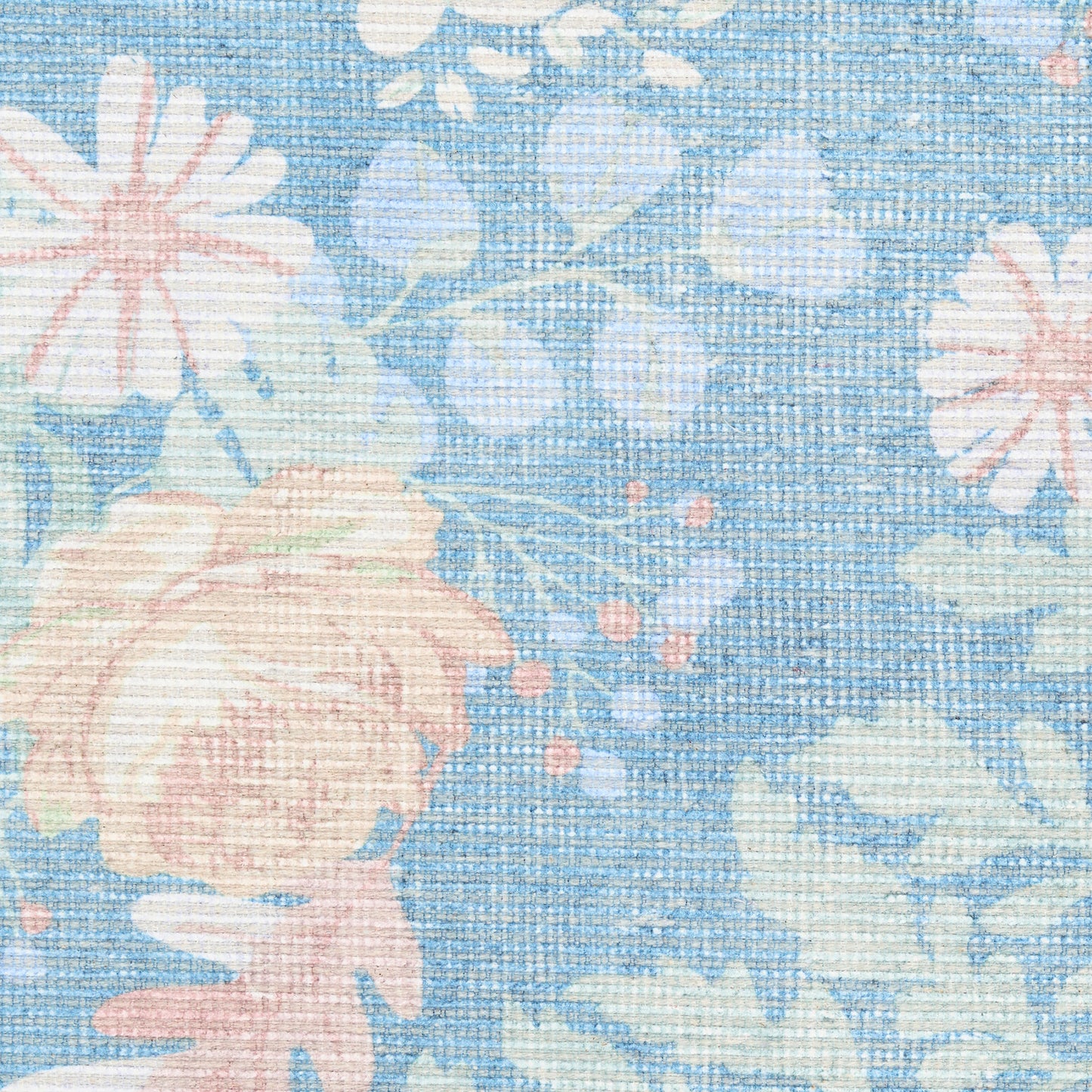 Blue woven rug featuring pastel pink roses and light blue flowers in a jacquard-style floral pattern.