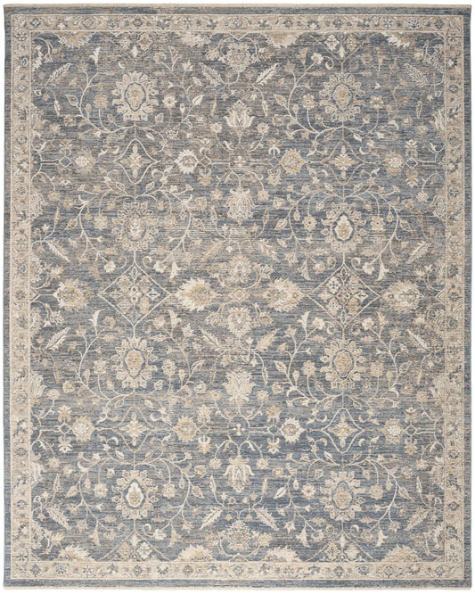 Blue-gray rug with cream floral vines and medallions; vintage distressed pattern, rectangular.