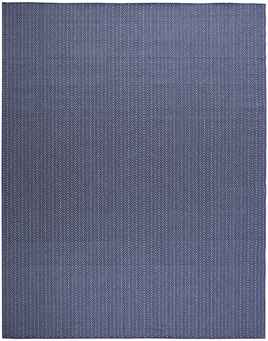 Rectangular navy rug with white chevron herringbone pattern for modern floor decor.