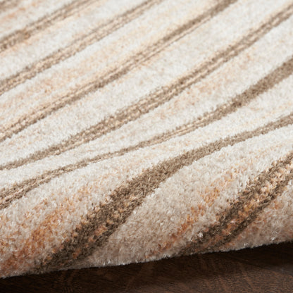 Beige and brown striped plush rug, close-up of soft textured pile with diagonal pattern.