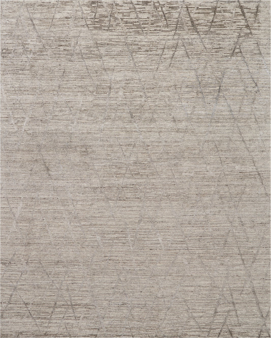 Neutral beige area rug with soft texture and a faint circular and diamond geometric pattern in taupe.