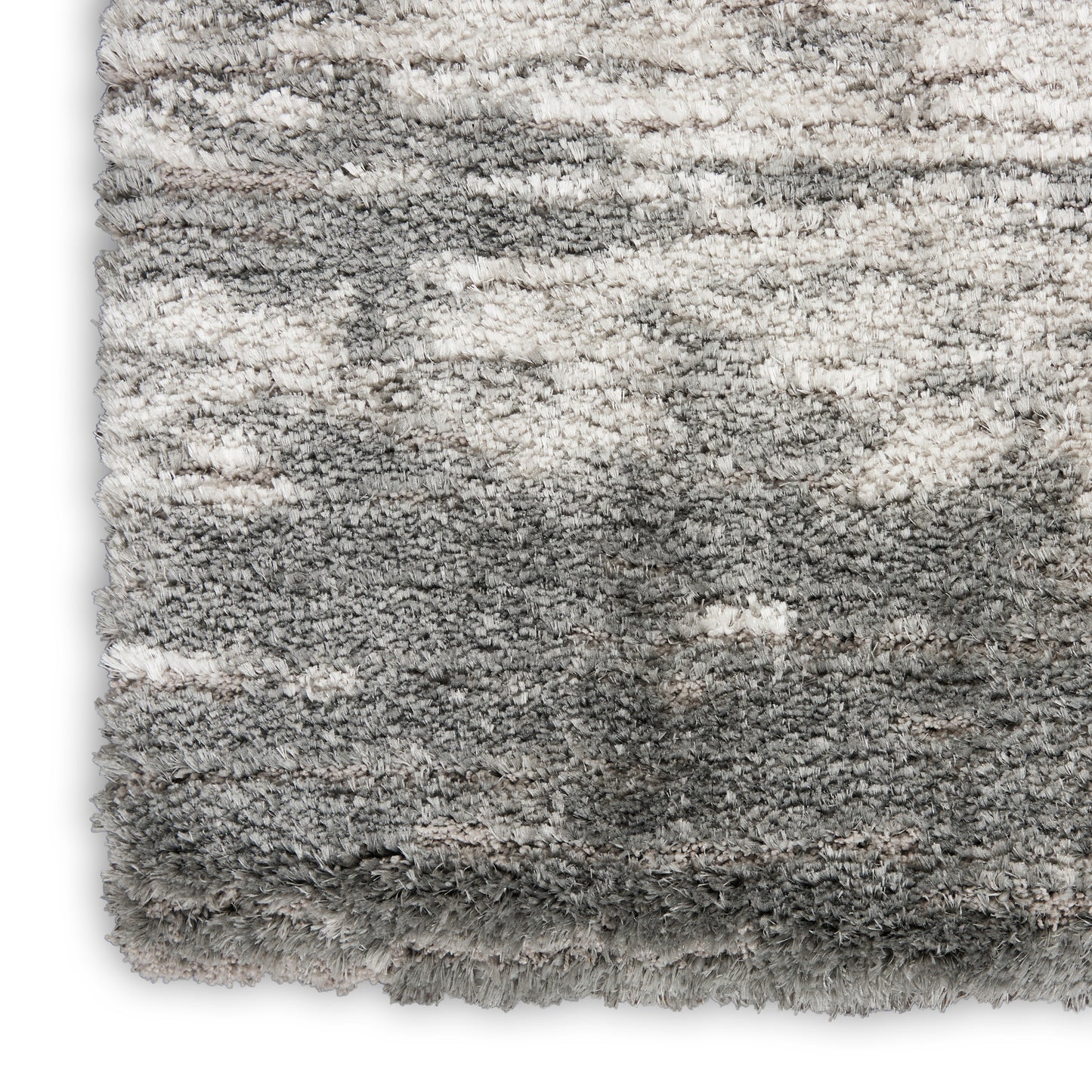 Soft plush grey shag rug with gradient from ivory to charcoal and thick fluffy pile.
