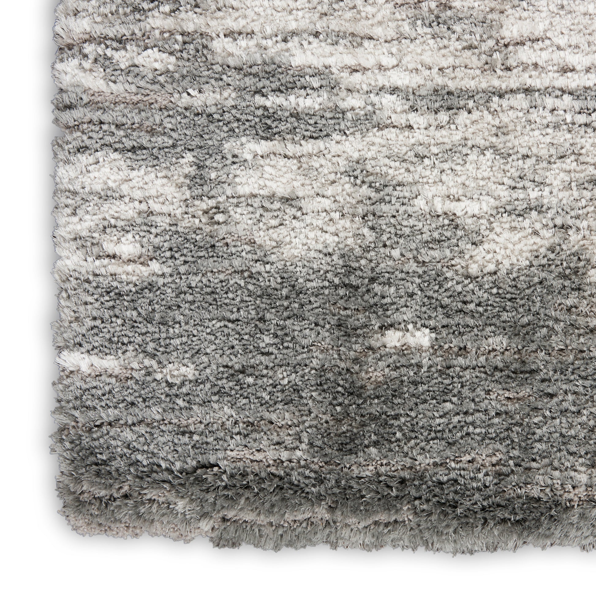 Soft plush grey shag rug with gradient from ivory to charcoal and thick fluffy pile.