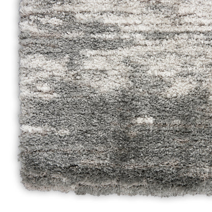 Soft plush grey shag rug with gradient from ivory to charcoal and thick fluffy pile.
