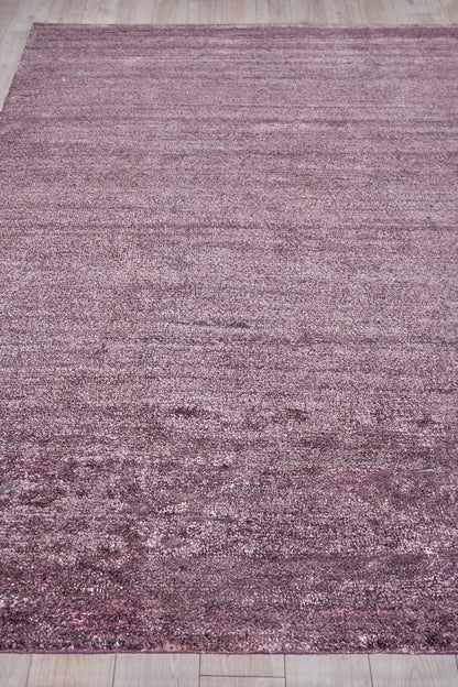 Rectangular mauve pink rug, plush indoor hand-knotted with subtle shading, 2' x 3'.