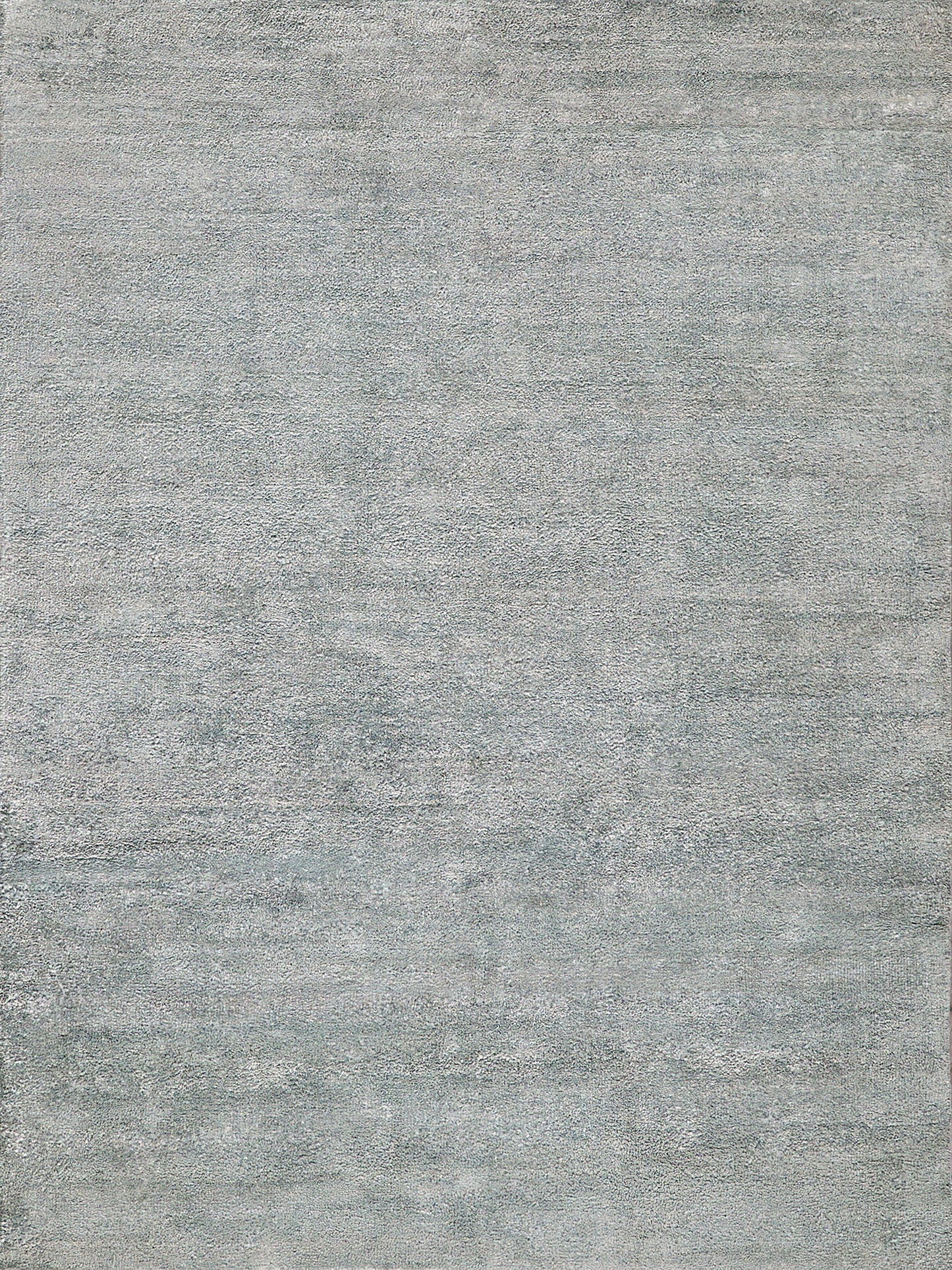 Rectangular gray-blue rug with a washed, distressed texture; soft, modern decor for living rooms.