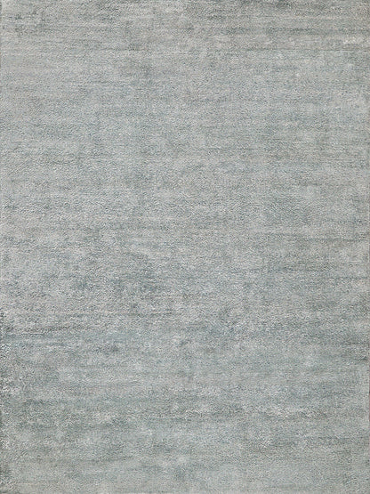 Rectangular gray-blue rug with a washed, distressed texture; soft, modern decor for living rooms.