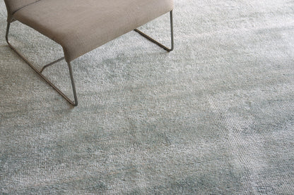 Plush indoor hand-knotted rug, 2' x 3', in blue-gray tones.