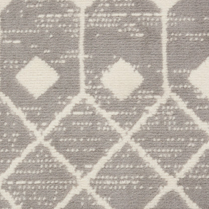 Neutral woven runner rug in ivory and taupe-gray with a diamond geometric pattern; rustic, modern living-room accessory.
