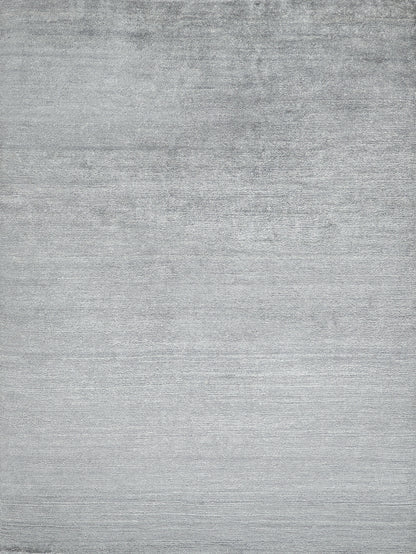 Flat gray brushed texture on a plush indoor hand-knotted rug; neutral surface with subtle horizontal grain.