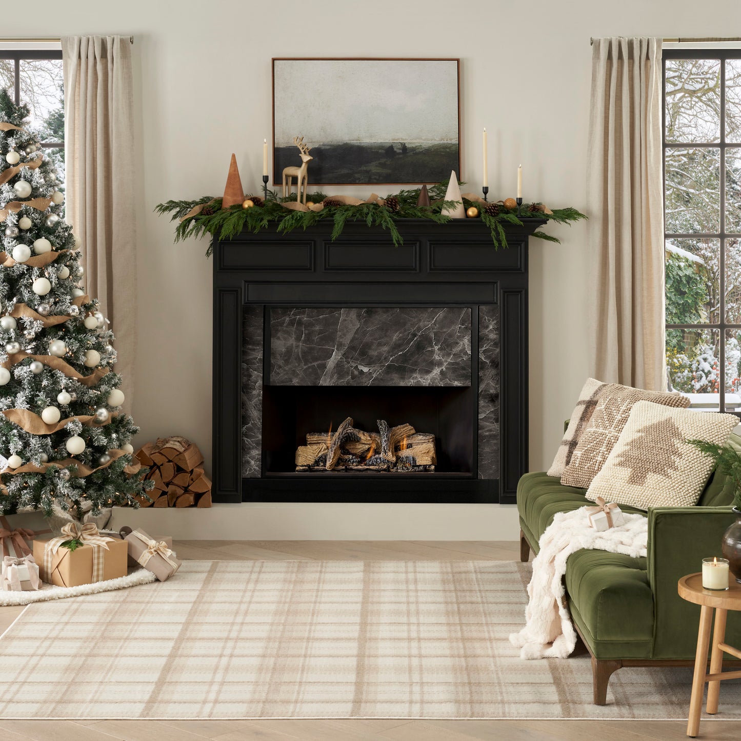 Black marble fireplace with garland, candles; Christmas tree, gifts, green sofa, beige plaid rug in cozy holiday living room.