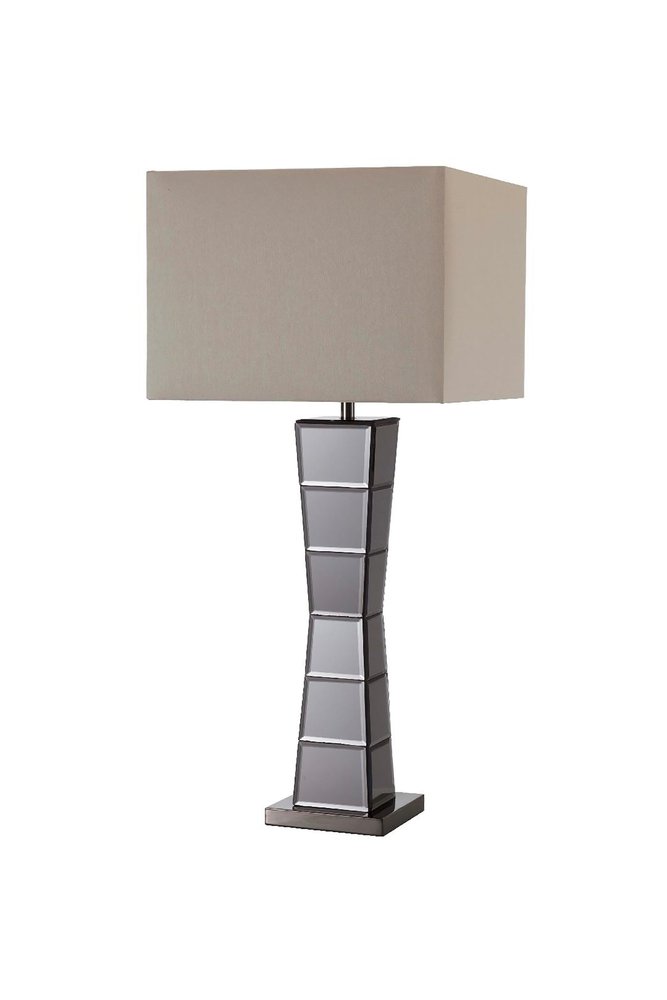Black glass tower table lamp with a tall, faceted base and a large rectangular beige fabric shade.