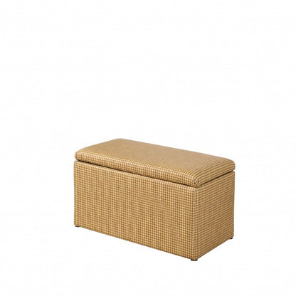 Rectangular 17" bench with yellow and brown upholstered faux leather and a flip-top lid, on short feet.