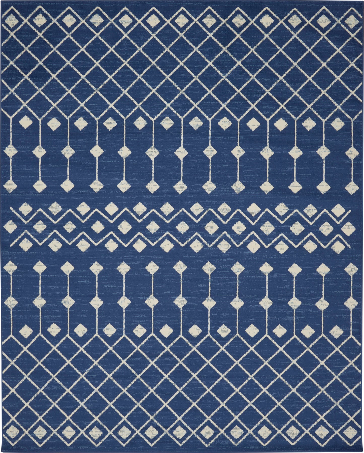 Navy blue rug with white diamond lattice pattern and vertical line motifs for contemporary decor.