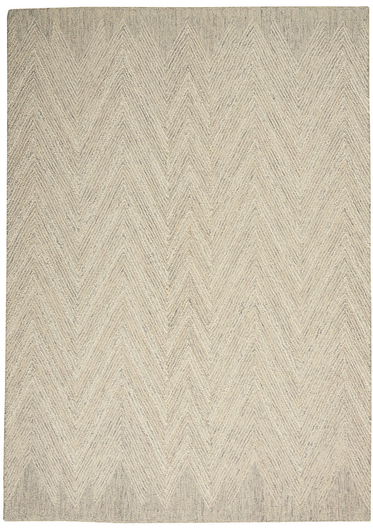 Beige textured wool blend rug with a subtle chevron/herringbone zigzag pattern in cream and taupe.