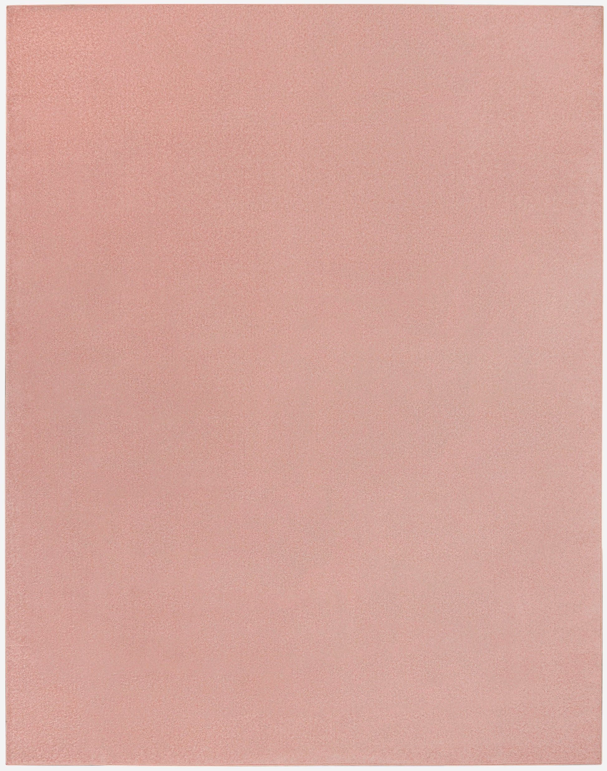 Dusty pink rectangular outdoor rug with a soft suede-like texture.