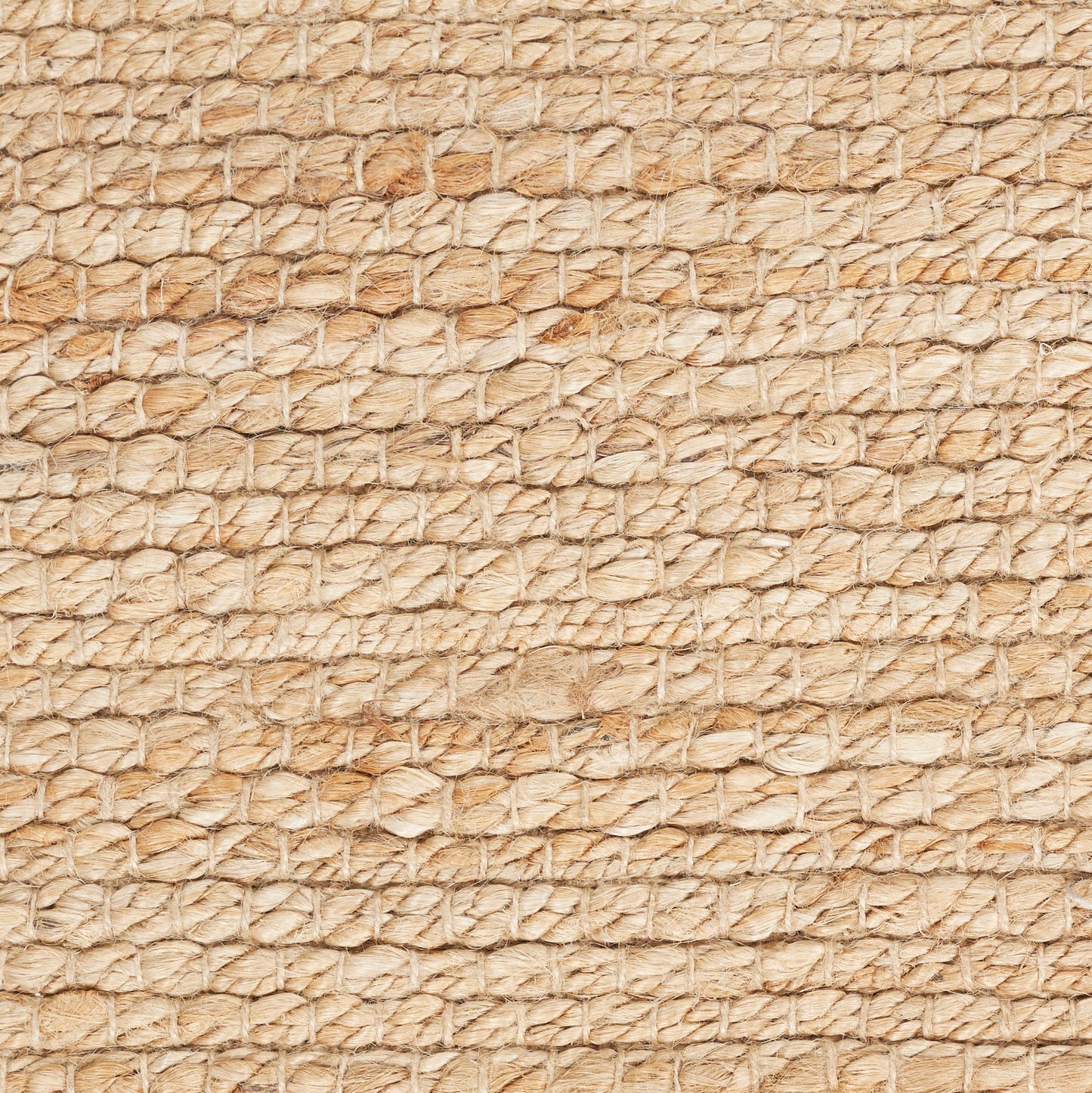 Beige natural fiber rug with coarse woven loops, rustic jute/sisal texture.